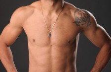 Jose Aldo posing his physique.