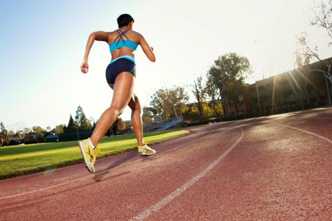 Woman Running On Track